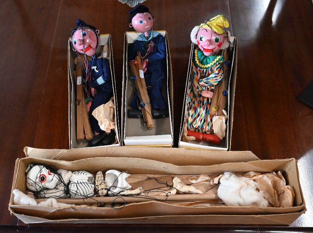 Four boxed Pelham Puppets - skeleton, clown, sailor and policeman (4)