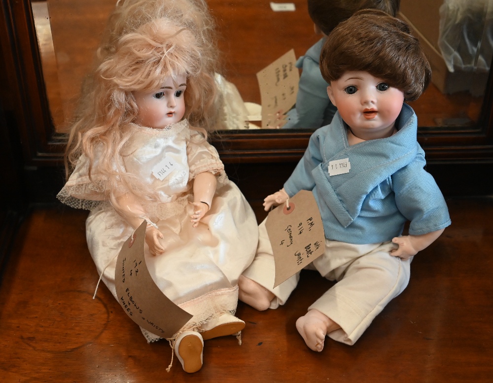 Two German bisque-headed dolls - one stamped 'PM194', the other '1/192/4' (2)