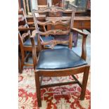 A set of four elm wavy ladderback dining carver chairs with dark blue vinyl pad seats