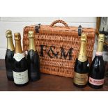 Fortnum & Mason wicker hamper with leather straps, to/w two bottles of Fortnum & Mason Brut