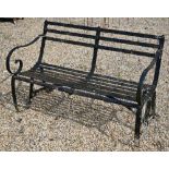 An antique black-painted wrought iron strap-work bench, 124 cm wide