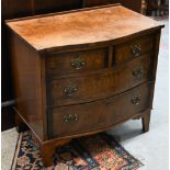 A small reproduction walnut serpentine front chest of two short over two long drawers on bracket