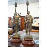A pair of gilt spelter figural table lamps after E Picault, 39 cm