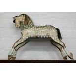 A gilt and cream painted wooden rocking horse (lacks rockers)