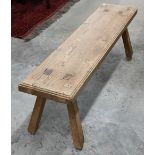 A rustic jointed elm pig bench, 124 cm wide x 30 cm deep x 40 cm high, the single plank top on