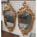 A pair of rococo style gilt framed wall mirror, 80 cm high x 42 cm wide, as found (2)