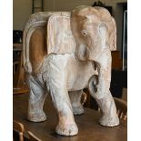 A limed hardwood stump chair carved as an elephant