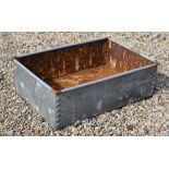 A galvanised rivetted trough