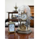A German brass 400-day anniversary clock with torsion pendulum under glass dome, 30 cm high to/w