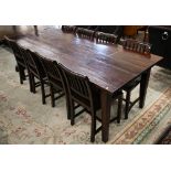 A modern stained hardwood rectangular dining table on tapering square supports, 225 cm wide x 95