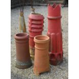 Two similar terracotta cylindrical chimney pots, both 66 cm high, to/w larger louvred example, 94 cm