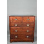 An Edwardian shallow stained chest of two short over three long graduated drawers, on bun feet,