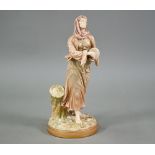 A late Victorian Royal Worcester gilded figure of a woman beating a small drum, impressed