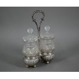 A late 19th Century Dutch pair of hobnail-cut glass jars and covers in .833 standard silver stand