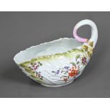 A Chelsea Derby porcelain leaf-moulded sauce-boat with applied floral decoration, organic handle and