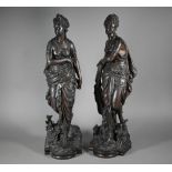 A companion pair of 19th century bronze patinated spelter figures of classical Greek maidens, 53