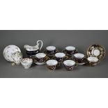 A part set of Spode china blue and gilt tea wares, pattern 892, comprising eight cups and six