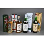 Three boxed/tinned bottles of single malt whisky - Laphroaig (Isle of Islay), The Glenlivet (St