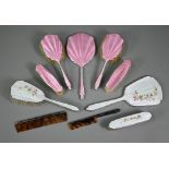 A basse-taille and floral enamelled silver four-piece brush set including hand-mirror and comb (