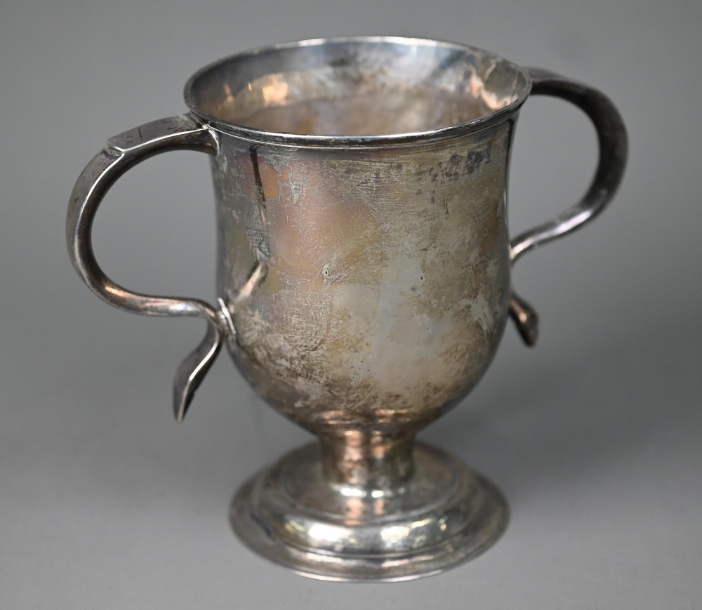 A George III silver loving cup with twin scroll handles on plain stem and domed foot, Charles