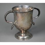A George III silver loving cup with twin scroll handles on plain stem and domed foot, Charles