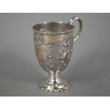 WITHDRAWN A Victorian silver Christening cup with embossed floral decoration