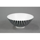 A Wedgwood pottery black and white fluted bowl by Norman Wilson, stamped 'Wedgwood N. W.', 21 cm