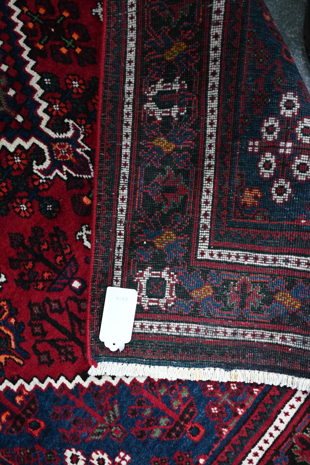 A North West Persian Josheghan rug, the deep red ground with geometric design, 215 cm x 135 cm - Image 3 of 3