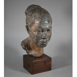 Pamela F. De Ville,  'Dolly', a bronze patinated clay bust of a young woman, raised on a wooden