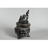 A Japanese bronze incense burner (koro) and pierced domed cover surmounted by a guardian lion (