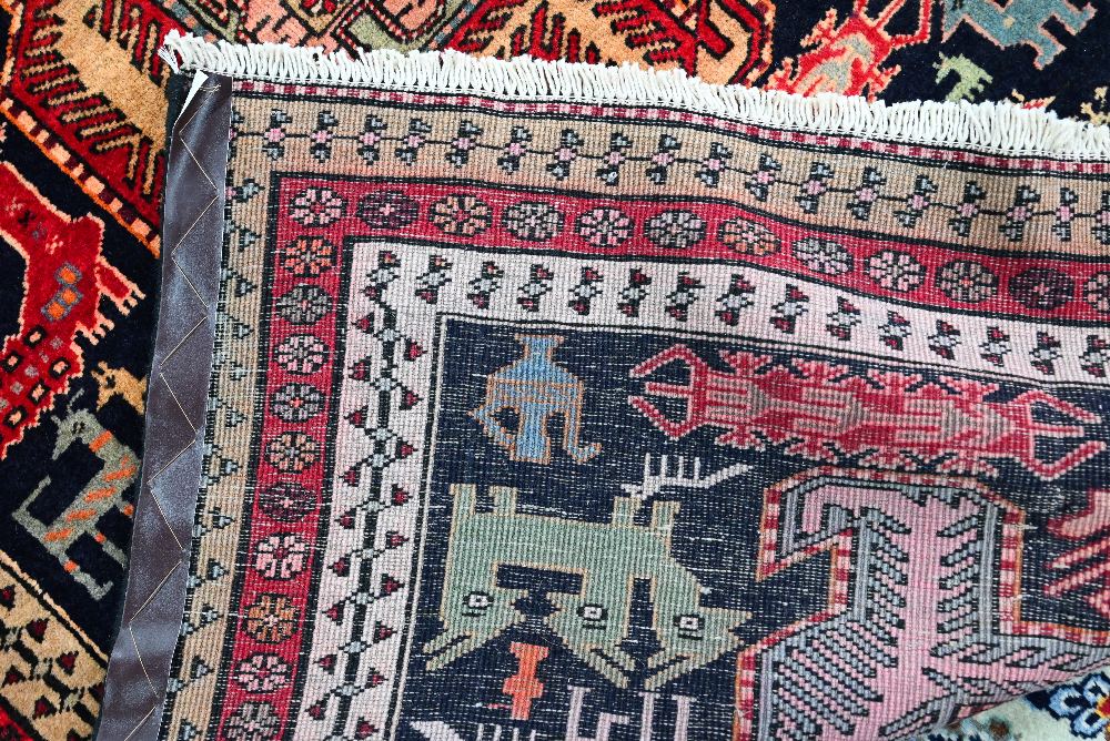 A contemporary North West Persian Tafresh rug, the dark blue ground with gelmetric symbols, birds, - Image 3 of 3