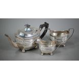 A late Victorian heavy quality silver three-piece tea service in the Regency manner, with