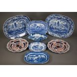 A pair of 19th century blue and white pottery meat dishes, printed with a rural scene within a