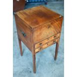 A Georgian mahogany work table, the hinged top enclosing a (now) vacant well over two drawers,