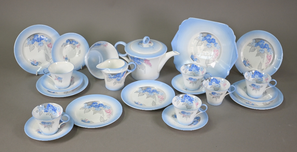 An Art Deco Shelley china tea service, printed and painted with the 'Phlox' pattern within blue