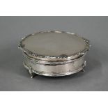 A circular silver ring-box with hinged over, Birmingham 1927, 9cm diameter