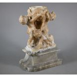 An antique Italianate carved alabaster urn supported by three putti, 34 cm