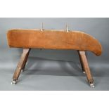 A vintage suede covered gymnasium vault horse, rasied on square adjustable legs - a/f