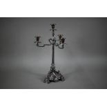 A large Victorian electroplated three-branch candelabrum with four sconces raised on a reeded