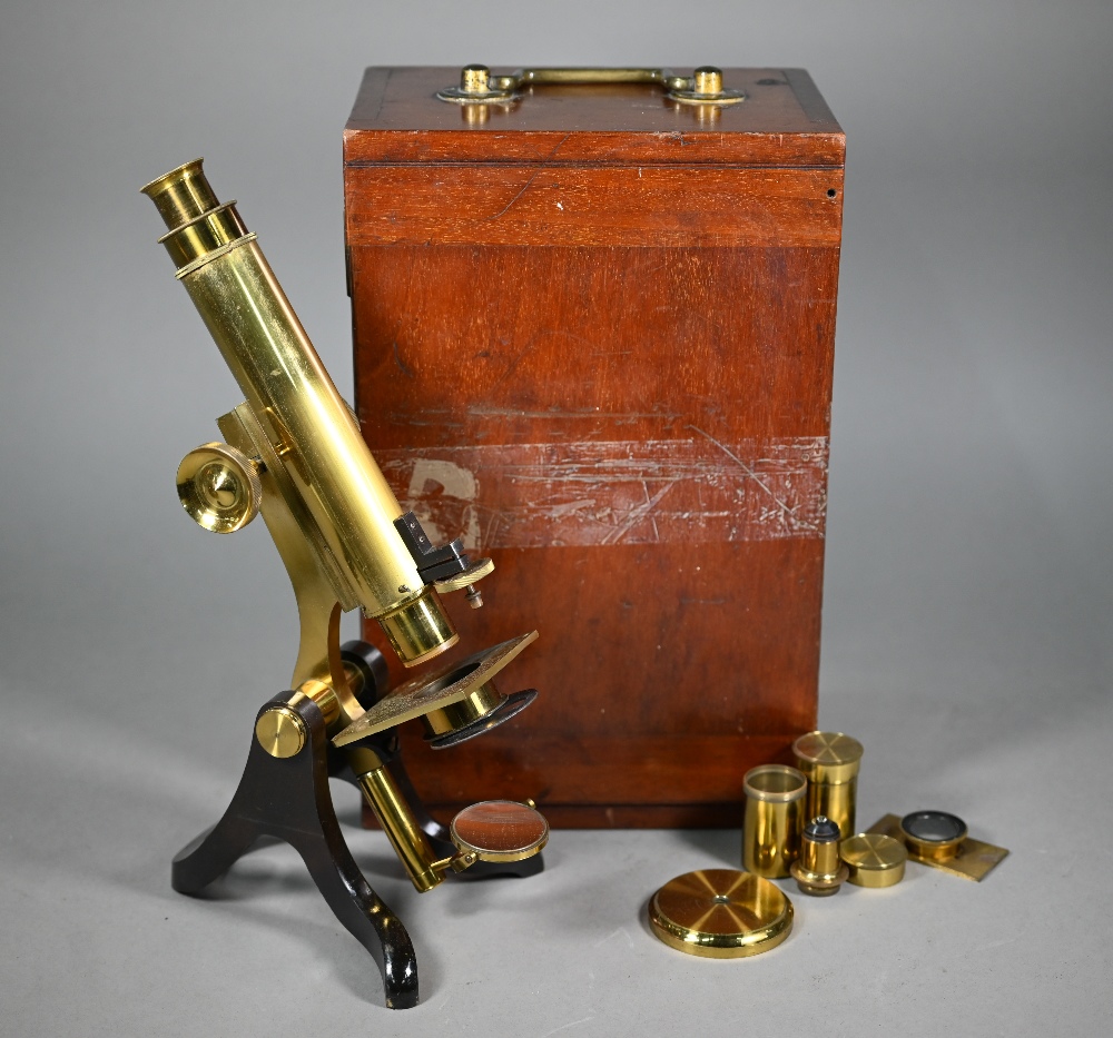 An antique brass binocular microscope by Henry Crouch, London Wall, no 461, in fitted mahogany
