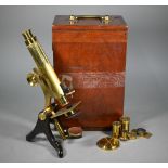 An antique brass binocular microscope by Henry Crouch, London Wall, no 461, in fitted mahogany