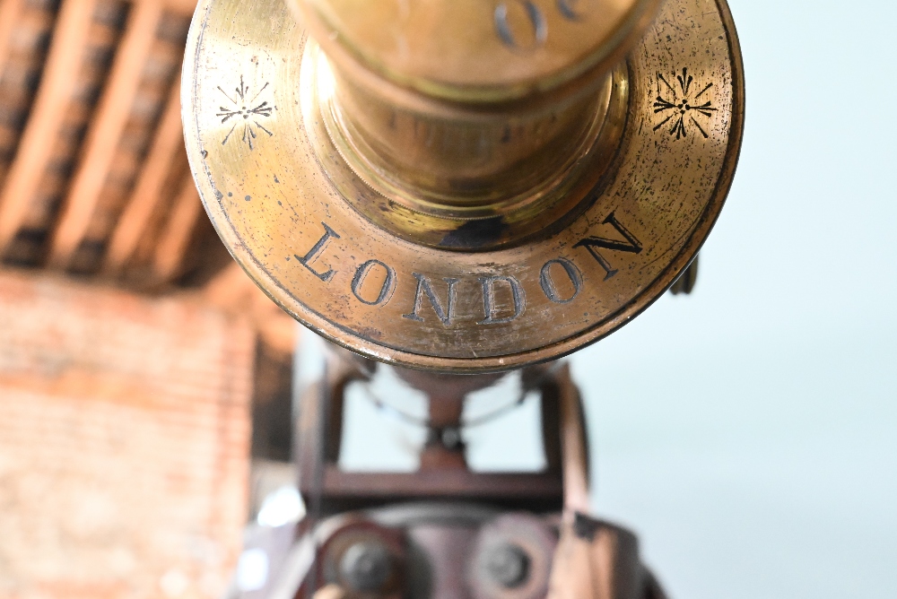 Dolland, London, a late 19th century brass tube telescope, raised on a folding wooden tripod stand - - Image 9 of 14