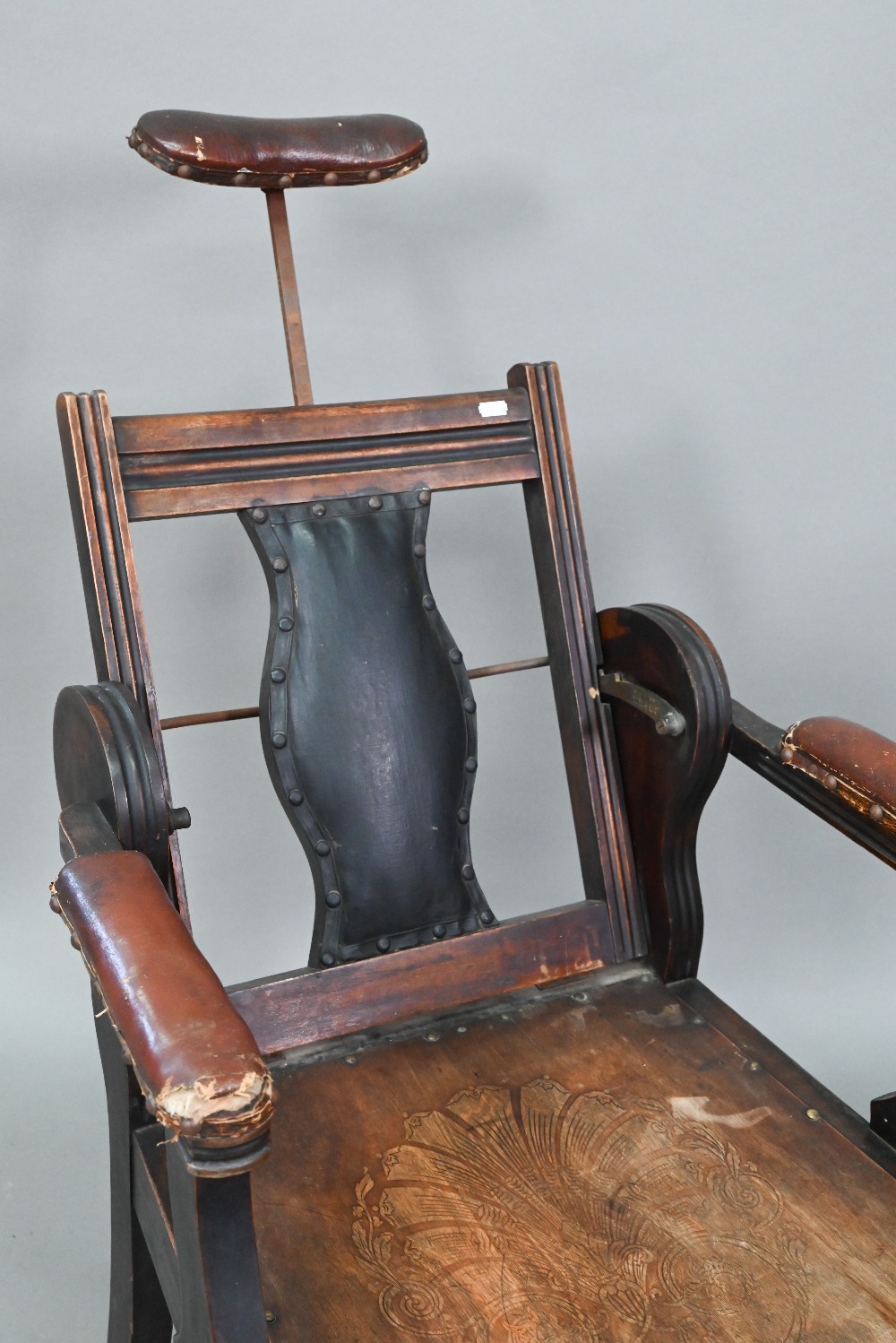 An early 20th century barber's chair, bears makers plate for J W Clarke, Borough, London - Image 4 of 8