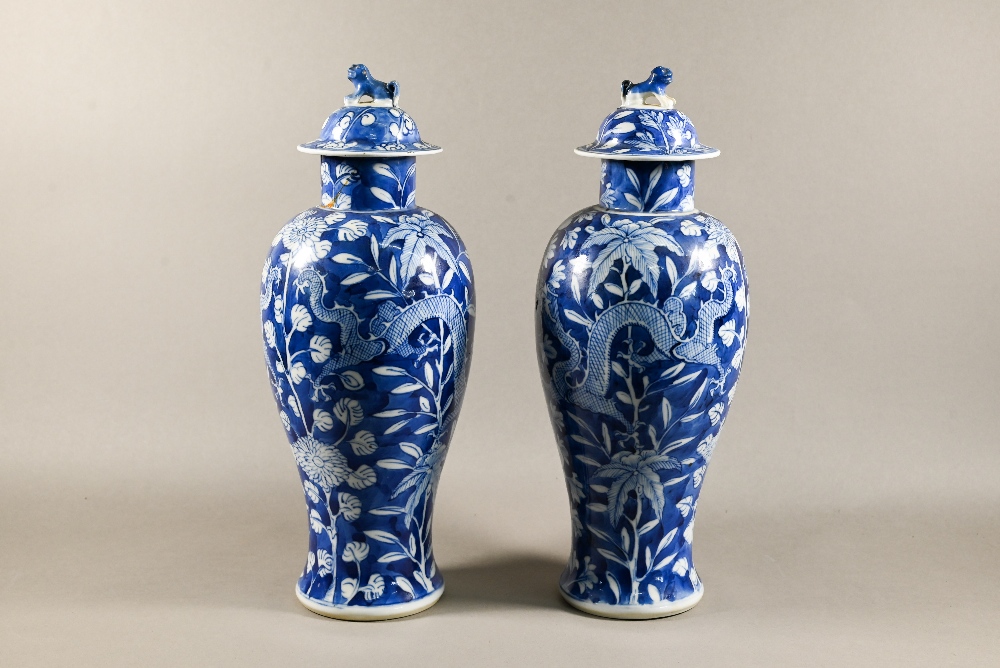 A pair of 19th century Chinese blue and white vases with domed covers surmounted by guardian lion - Image 2 of 12