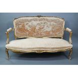 An antique giltwood framed French salon sofa, with remnants of the original Aubusson tapestry back