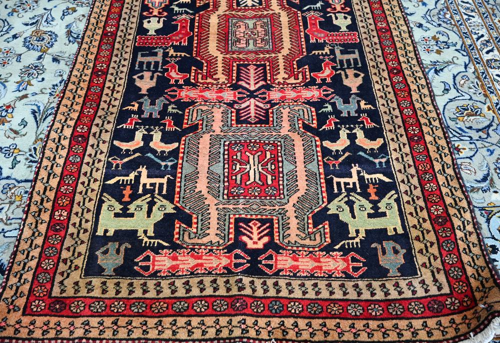 A contemporary North West Persian Tafresh rug, the dark blue ground with gelmetric symbols, birds, - Image 2 of 3