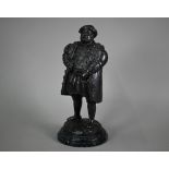 A dark patinated bronze figure of King Henry VIII, on wooden base, 34 cm h