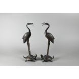 A pair of early 20th century Japanese bronze crane and turtle (tsuru-kame) okimono, Meiji or