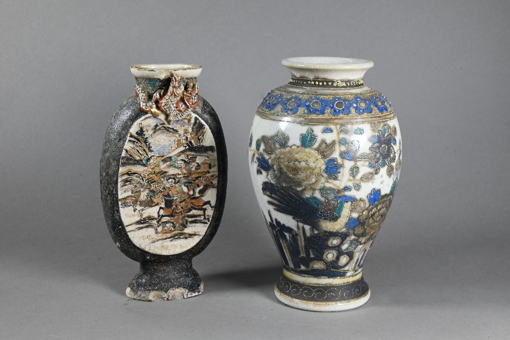 A 19th century Japanese vase of flattened oval form with applied dragon around the short neck,