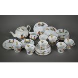 An Art Deco Colclough china nursery tea service for six, printed with young children and their toys,